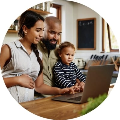 Family looking at a laptop
