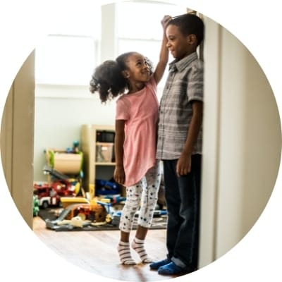 Kids measuring their heights
