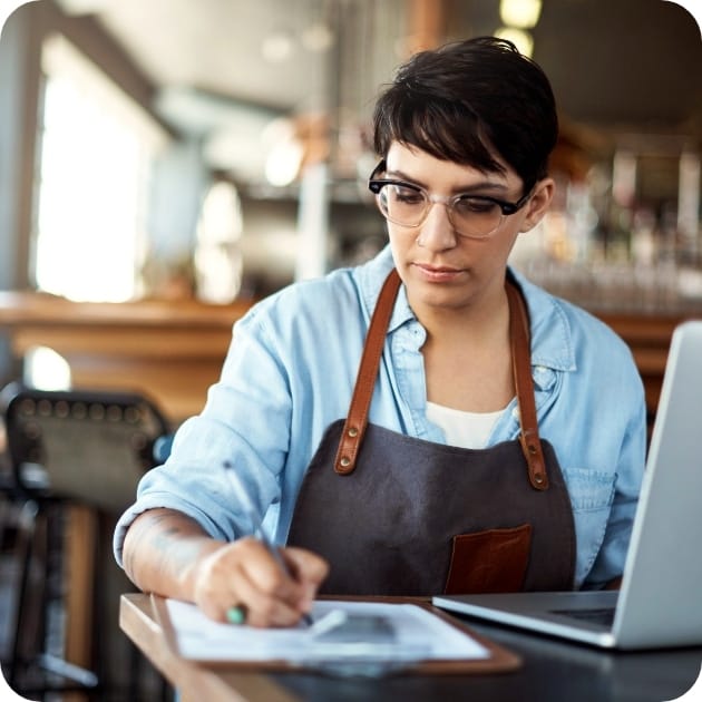 Woman writing in a notepad