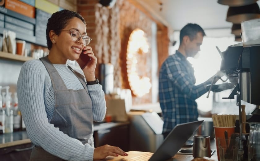 Two people working in a coffee shop